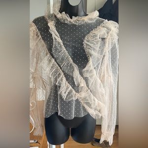 Long sleeve sheer polka dots with ruffles in the front